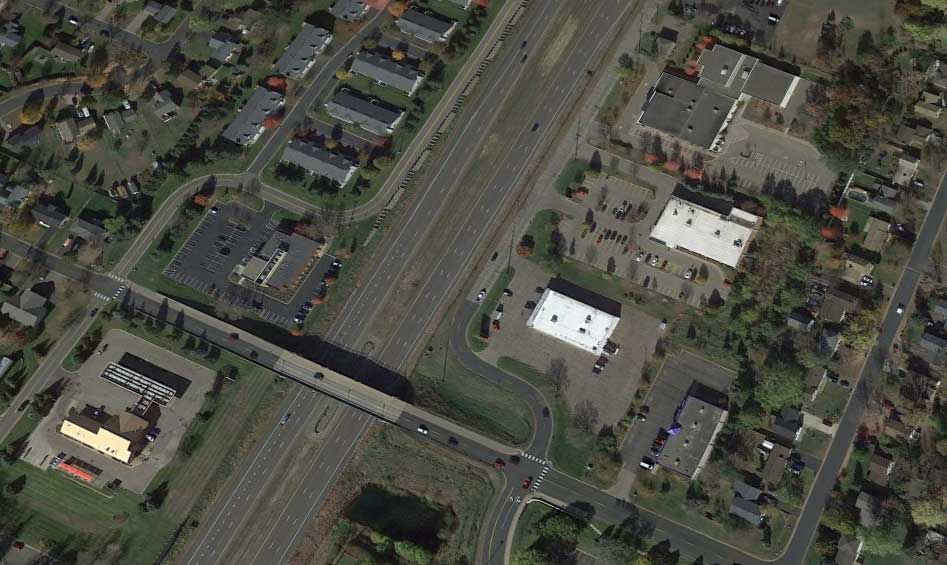 Aerial image of smaller frontage roads that run alongside the highway.